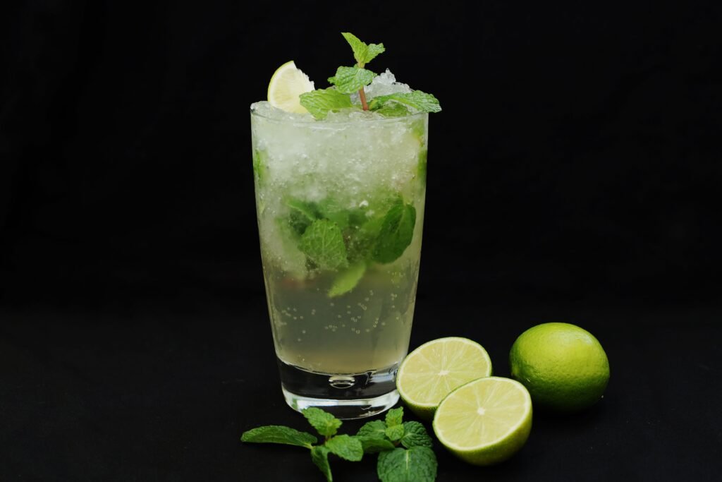 Chilled mojito cocktail garnished with fresh lime and mint.