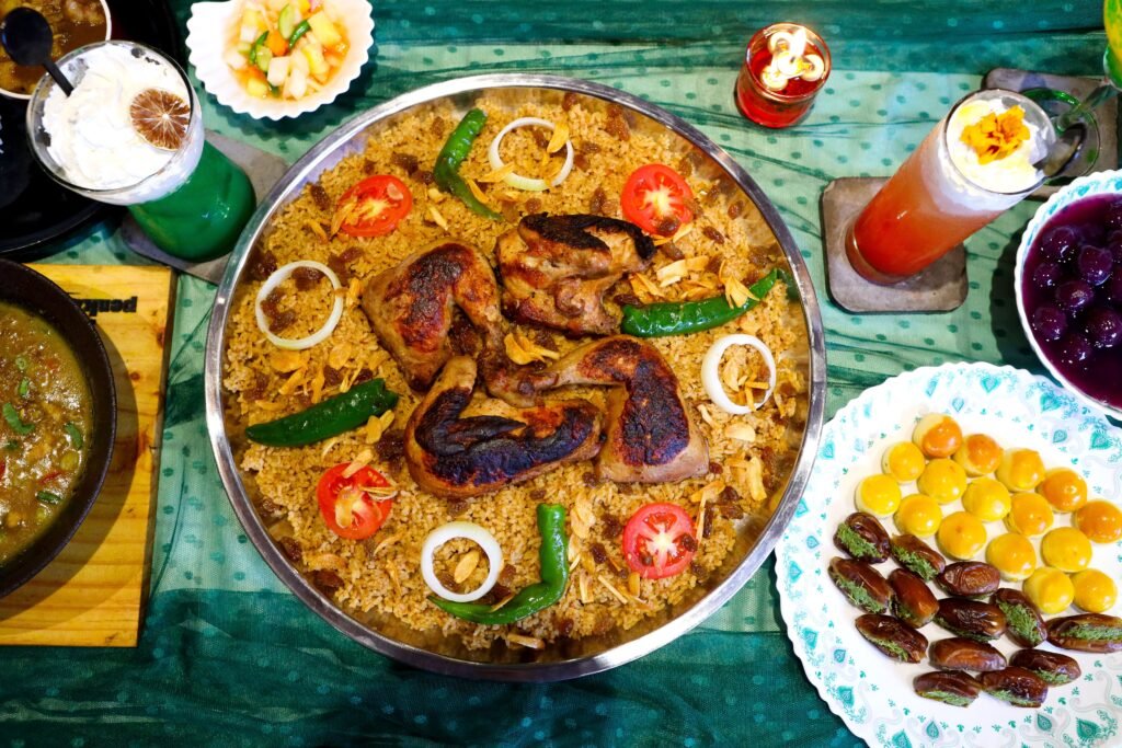 Rich display of Indonesian cuisine, showcasing traditional grilling and vibrant beverages.